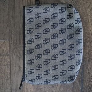 Dooney And Bourke Monogram Brown Pouch  Very Clean Condition.